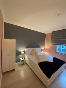 a bedroom with a large bed and a window at Hotel Sophia in Warendorf