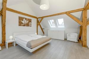 Postel nebo postele na pokoji v ubytování TGM Hotel Residence