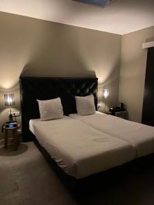 Łóżko lub łóżka w pokoju w obiekcie CampIn Hotel