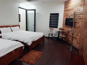 En eller flere senger på et rom på Toan Mai Sapa Guesthouse