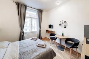 Postel nebo postele na pokoji v ubytování Maison Residence Prague