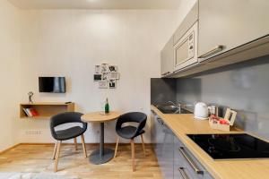 Kuchyň nebo kuchyňský kout v ubytování Maison Residence Prague