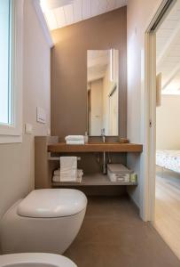 a bathroom with a toilet and a sink at ARIA Design B&B Levanto in Levanto