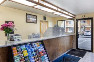 a cashier counter in a room with a window at Riverside Inn & Suites in Riverside