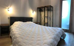 Ένα ή περισσότερα κρεβάτια σε δωμάτιο στο charmant duplex Résidence les Marmottes