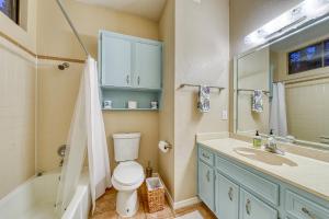 a bathroom with a toilet and a sink and a tub at Villa Marie in Austin