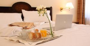 Een bed of bedden in een kamer bij Hotel Rector