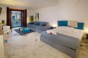 Posteľ alebo postele v izbe v ubytovaní Le Suites Del Duomo House