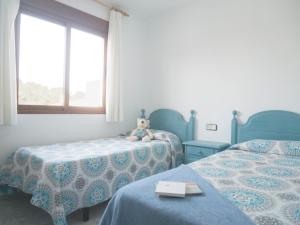 Postel nebo postele na pokoji v ubytování Apartamentos Marineu Jazmines