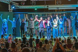 a group of people on a stage with their arms in the air at Riva Nuova Camping Village in Martinsicuro +63 photos