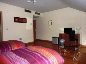 Cama o camas de una habitación en Hostal La Morada