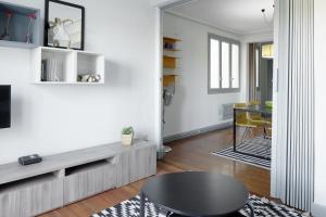a living room with a table and a dining room at Marrubi - Basque Stay in San Sebastián