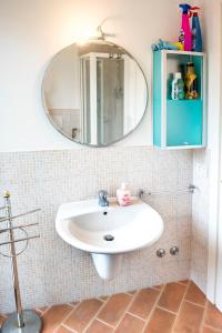 a bathroom with a sink and a mirror at N216 - Numana, cielo-terra nei vicoli a 200mt dal mare in Numana