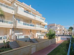 a large apartment building with stairs and balconies at Apartamentos Doña Maria in Alcossebre