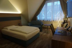 Postel nebo postele na pokoji v ubytování Hotel Kastanienhof