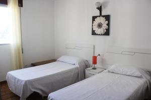Apartamentos Peñíscola Playa 3000にあるベッド