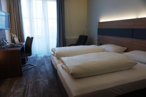 Postel nebo postele na pokoji v ubytování Hotel Kastanienhof