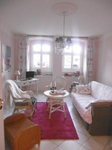 a living room with a couch and a table at Apartment Hermine in Görlitz