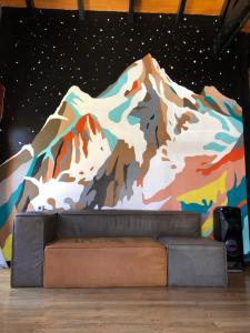 a mural of a mountain on a wall at Hostel Olimpo House in San Carlos de Bariloche