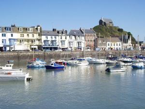 a group of boats are docked in a harbor at St James By the Quay in Ilfracombe