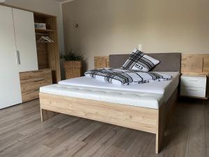a bedroom with a bed with a white mattress at Stadtvilla Intzeplatz - Apartment Sylt in Remscheid