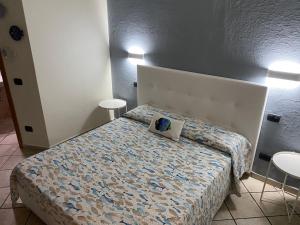 Un ou plusieurs lits dans un hébergement de l'établissement B&B ALDA