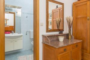a bathroom with a sink and a mirror at Villa Perka in Sveta Nedelja