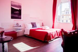 a bedroom with a bed and a large window at Relais Cola Di Rienzo in Rome