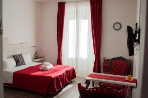 Posteľ alebo postele v izbe v ubytovaní Relais Cola Di Rienzo
