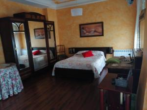 Cama o camas de una habitación en Hospedaje Menendez Pelayo