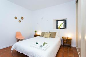 En eller flere senge i et værelse på Corral del Conde