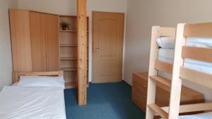 Posteľ alebo postele v izbe v ubytovaní Apartmány EDDY