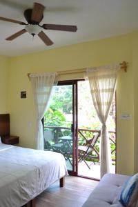 a bedroom with a bed and a sliding glass door at Verde Luna in San Francisco