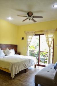 a bedroom with two beds and a ceiling fan at Verde Luna in San Francisco