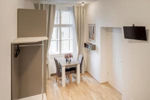 Kuchyň nebo kuchyňský kout v ubytování Maison Residence Prague
