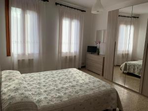 Llit o llits en una habitació de Appartamento Damiana