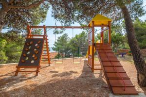 a playground with a slide in a park at Villa Perka in Sveta Nedelja