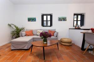 a living room with a couch and a table at Corral del Conde in Seville