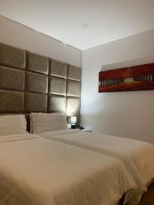 Voodi või voodid majutusasutuse Ramel Hotel toas