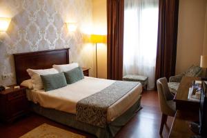 Postel nebo postele na pokoji v ubytování Hotel Pazo O Rial
