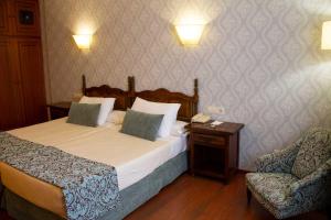 Postel nebo postele na pokoji v ubytování Hotel Pazo O Rial