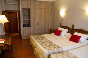 Postel nebo postele na pokoji v ubytování Hotel Pazo O Rial