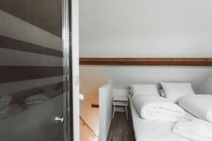Postel nebo postele na pokoji v ubytování HDC Nivelles Grand-Place