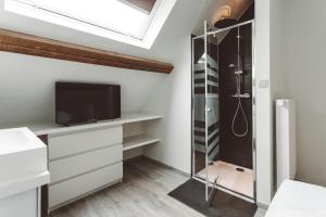 TV a/nebo společenská místnost v ubytování HDC Nivelles Grand-Place