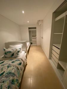Amora Villa - Vilamoura tesisinde bir odada yatak veya yataklar