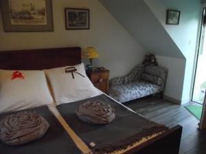 En eller flere senge i et værelse på Chambre d'hôtes Le Vaujoint