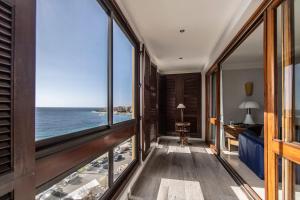 a room with a view of the ocean at Appartement Front de Mer Hyper Centre in Ajaccio