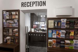 a book store with a sign that reads reception at Residence Corto Old Town in Prague
