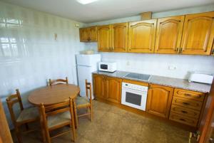 A kitchen or kitchenette at Club Villamar - Sport