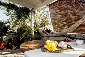 a table with a bowl of fruit on a patio at Dimora Antica Perla in Fasano